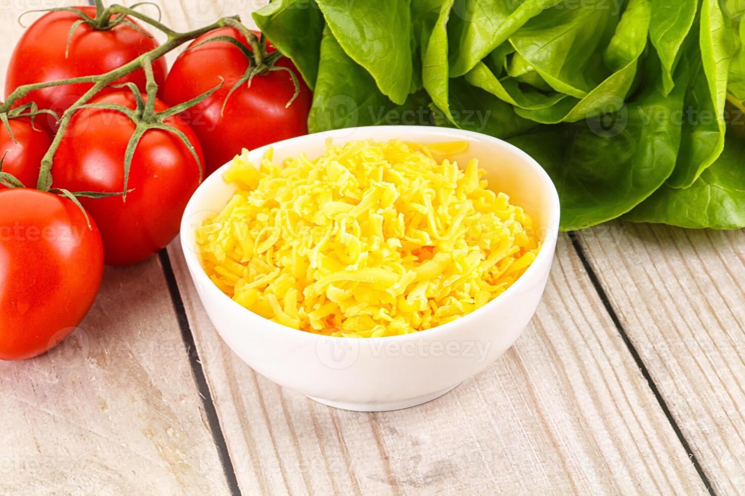 Shredded cheese in the bowl photo