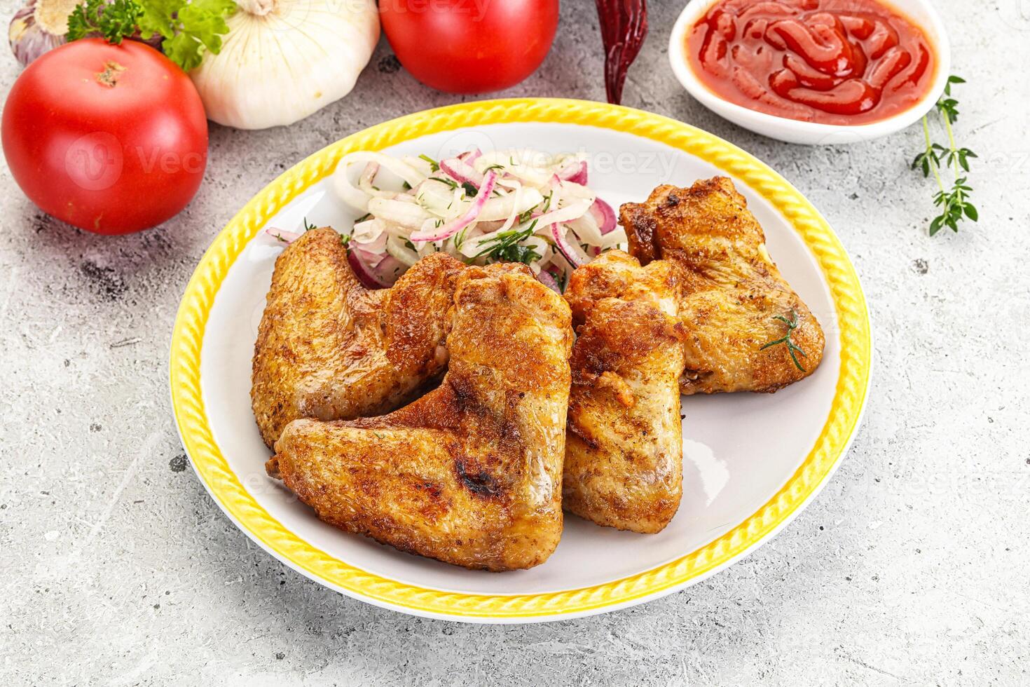 Grilled chicken wings with sauce photo