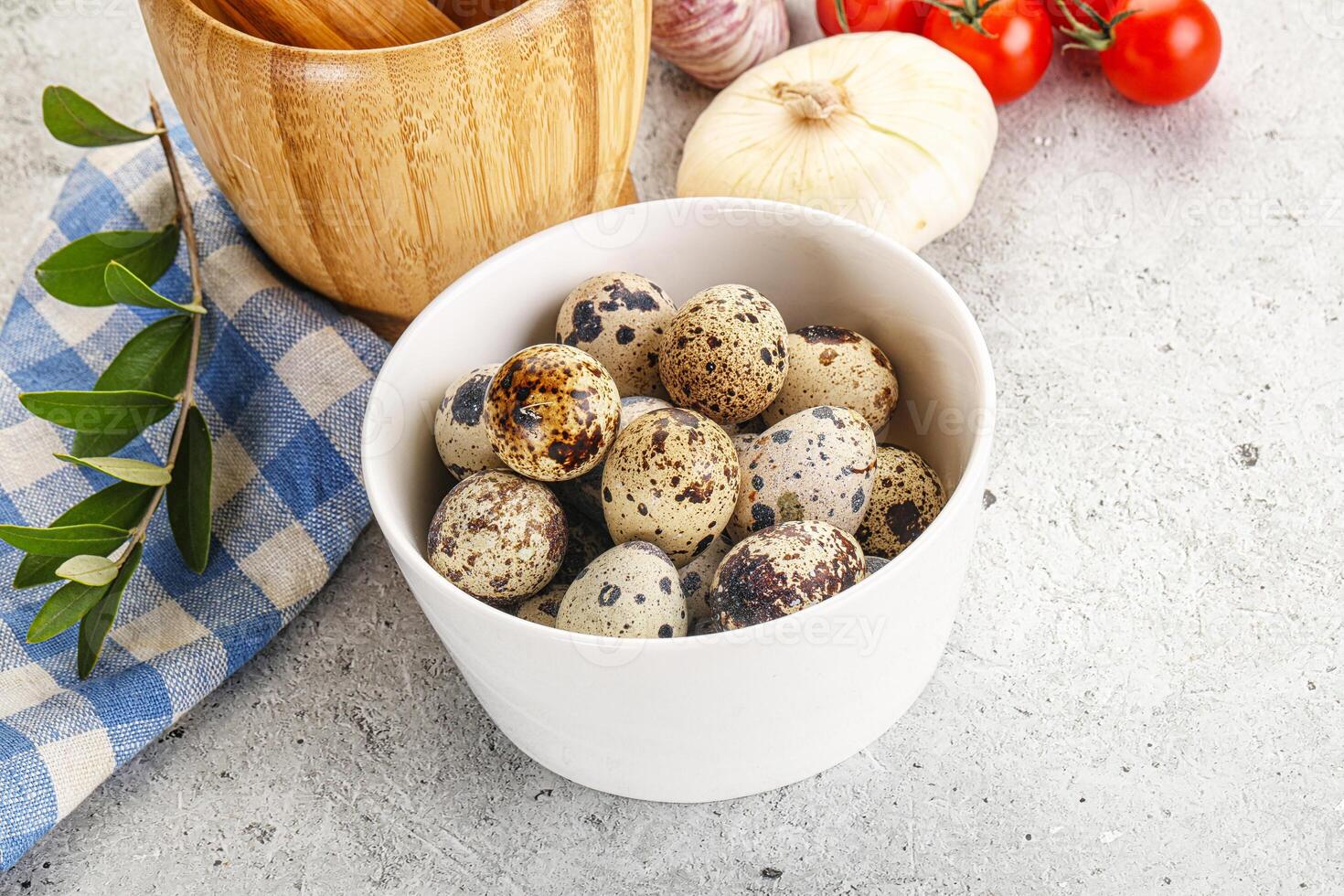 Raw quail eggs in the bowl photo