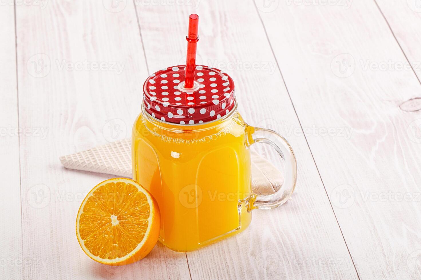 Sweet fresh orange juice in the glass photo