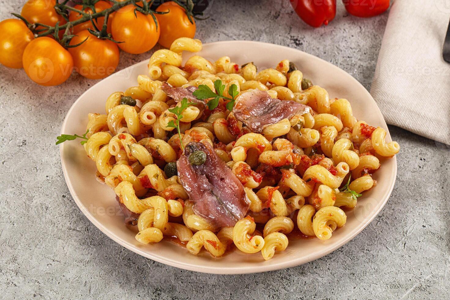 Italian pasta cellentani with anchovy photo