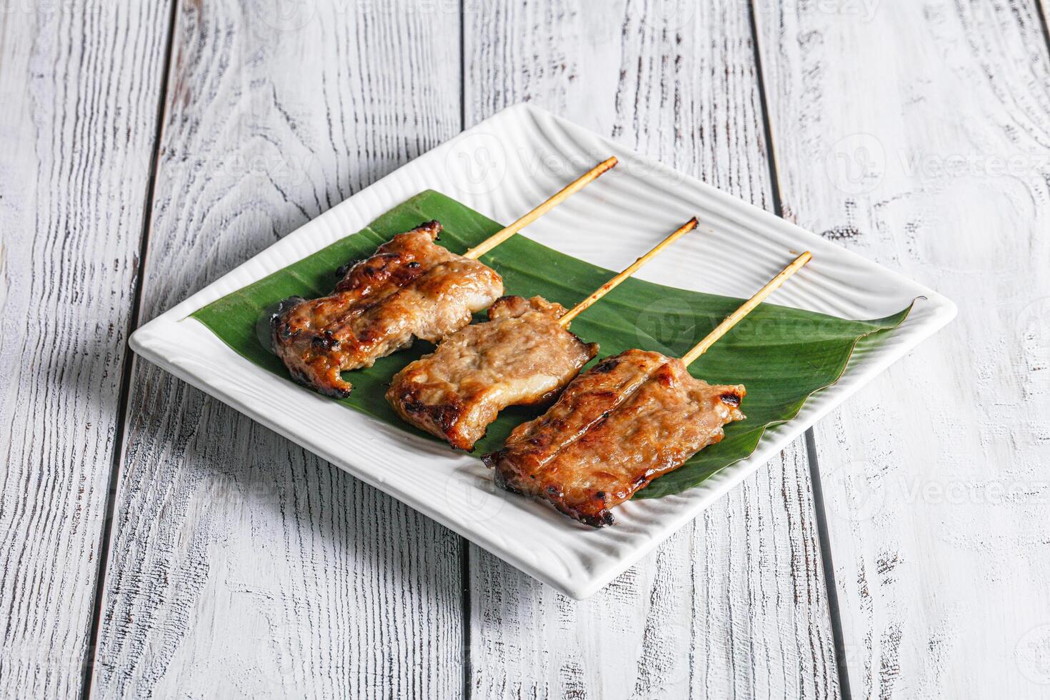 Thai cuisine - grilled pork skewer photo
