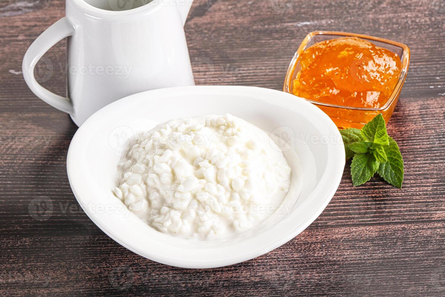 Grain curd with cream and jam photo