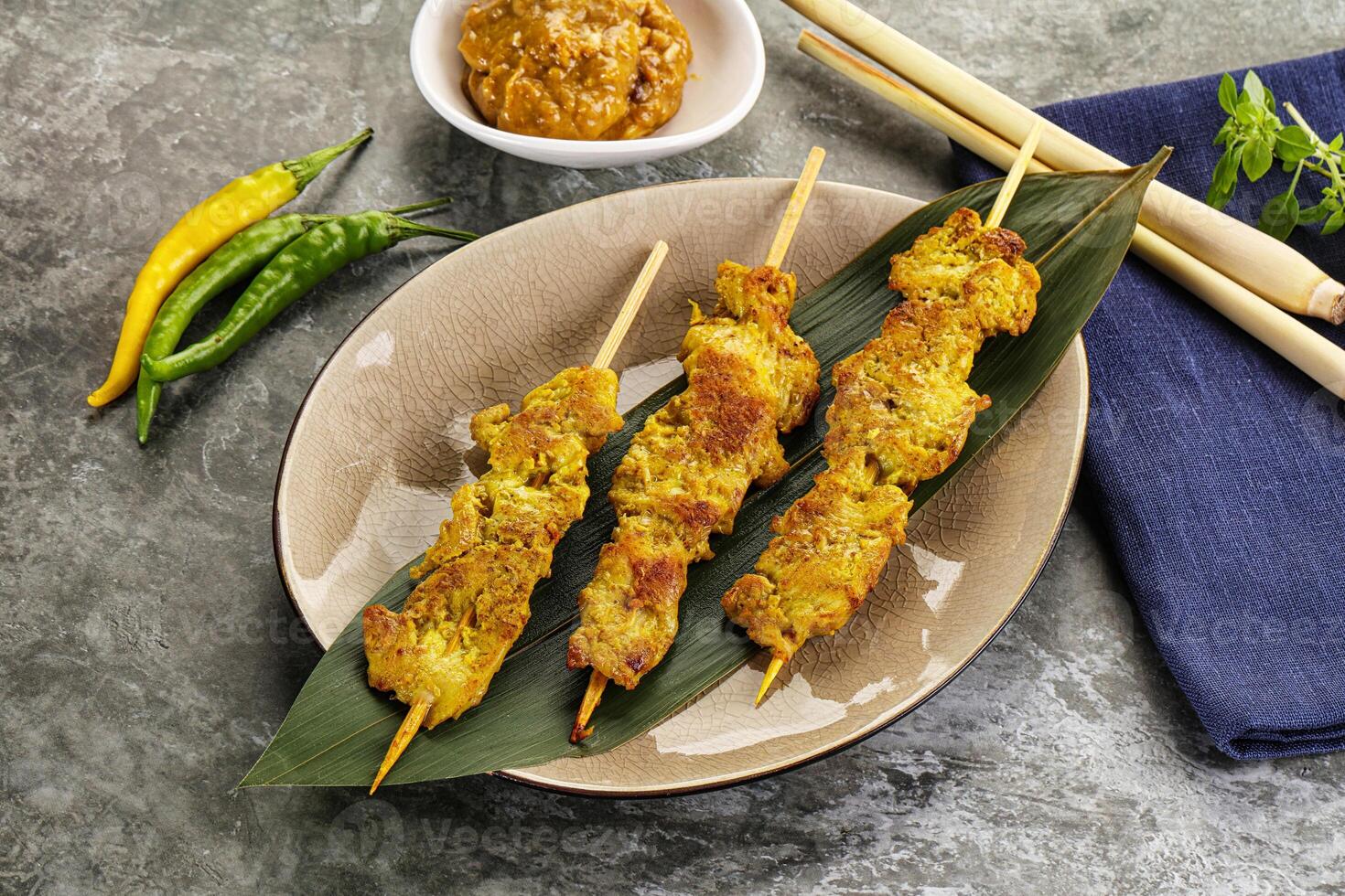 Thai meat skewer Satay with sauce photo