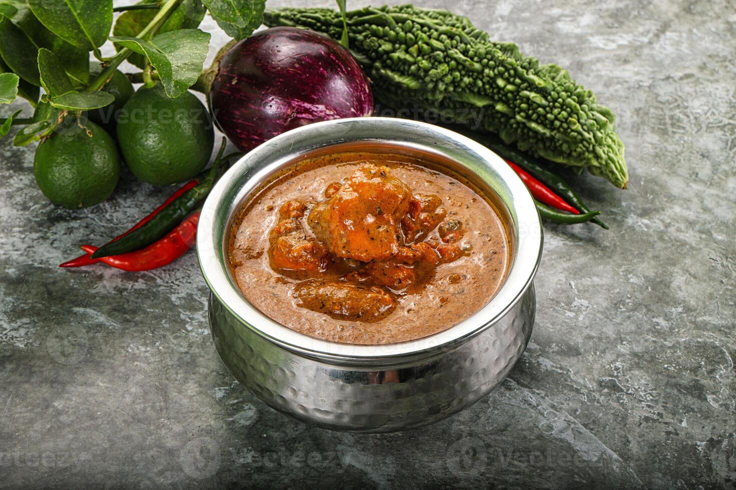 Indian cuisine - chicken curry with spices photo