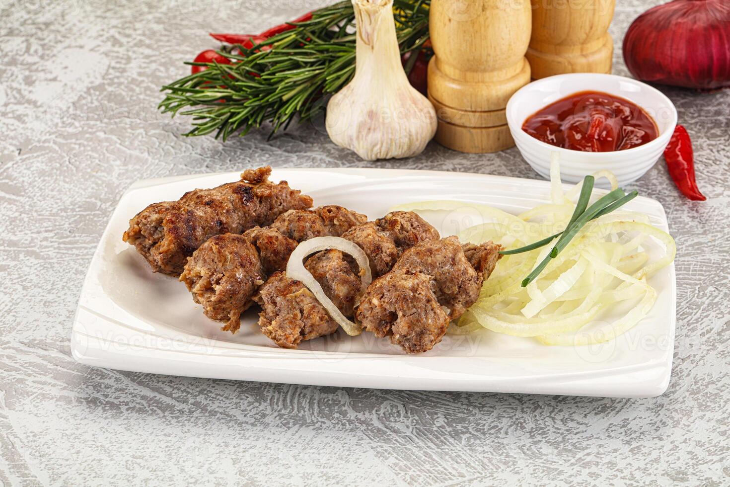 Beef kebab minced meat with onion photo