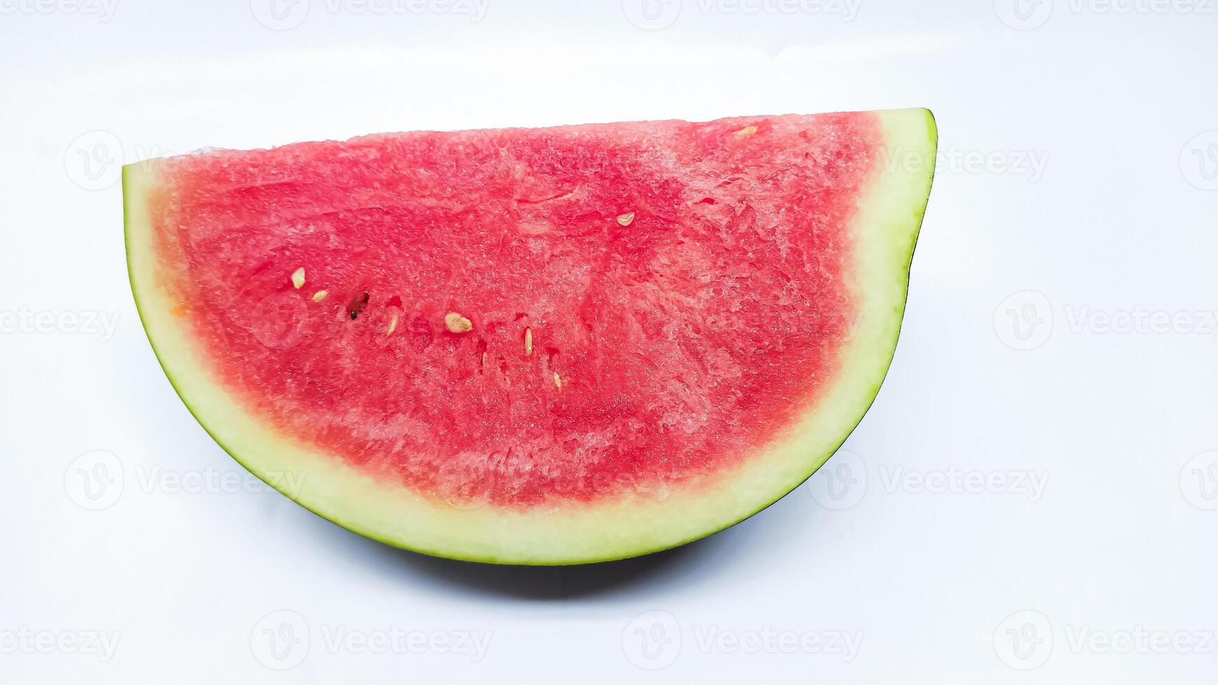 Slice of watermelon on white background photo