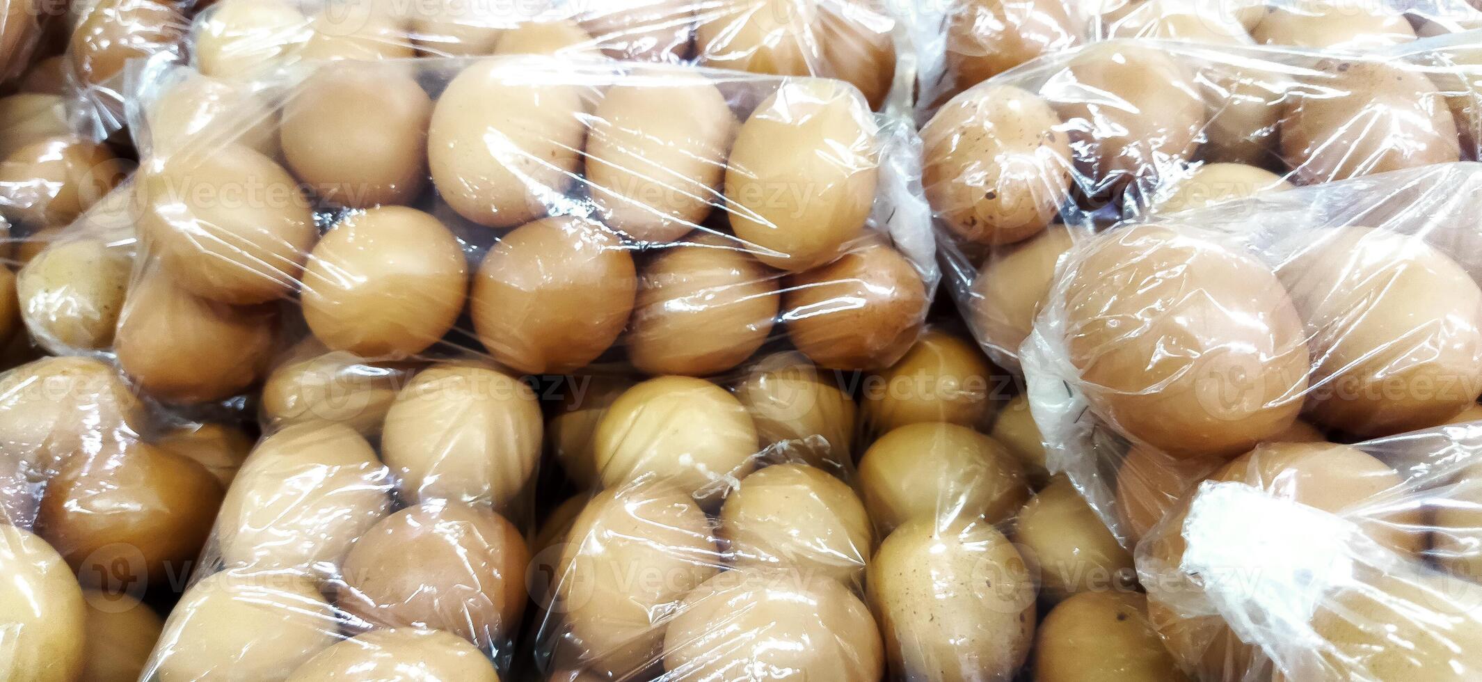 Display of raw chicken eggs in supermarkets photo