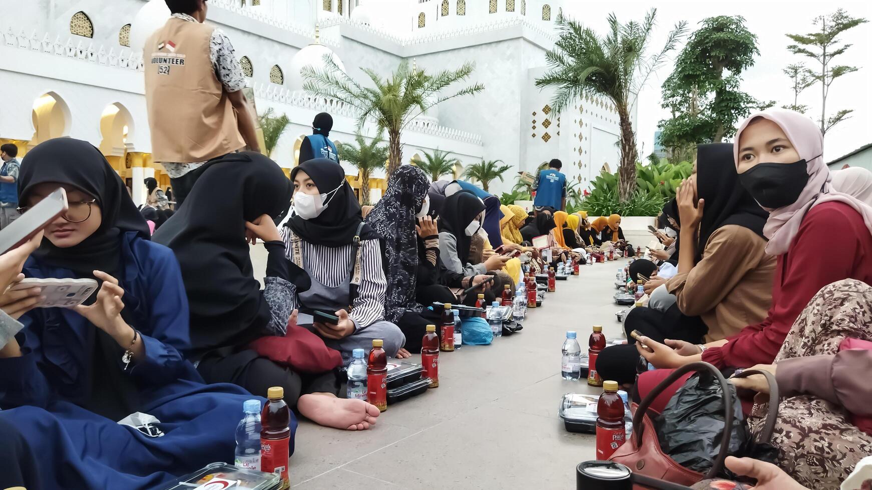 Surakarta, Central Java, Indonesia - April 14, 2023. Ramadan. Iftar. The atmosphere of preparing for breaking the fast together at the Sheikh Zayed Grand Mosque, Surakarta. photo