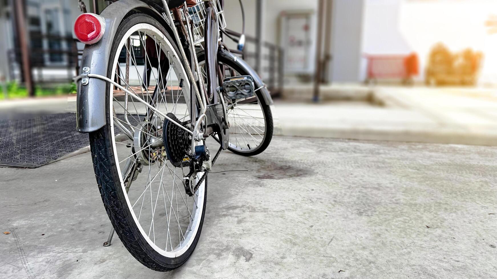 Close up parts of old school dark brown bicycle photo