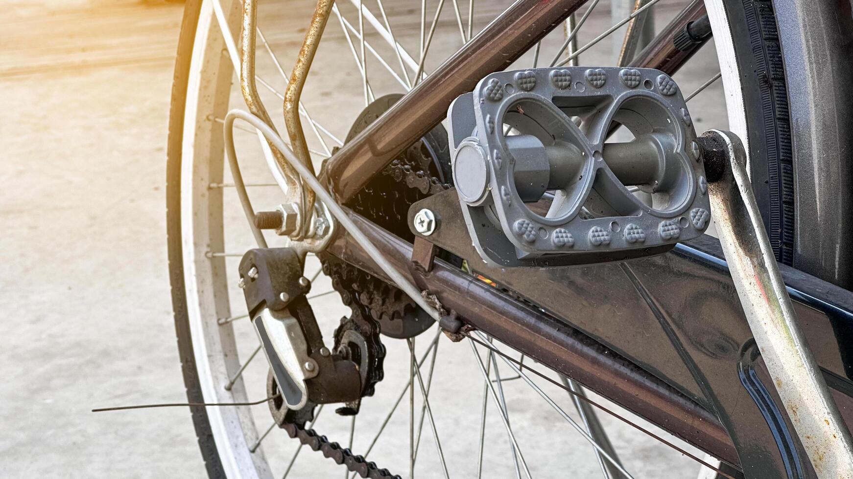 Close up parts of traditional dark brown bicycle photo