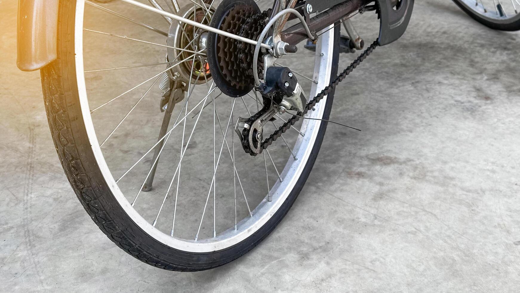 Close up parts of traditional dark brown bicycle photo