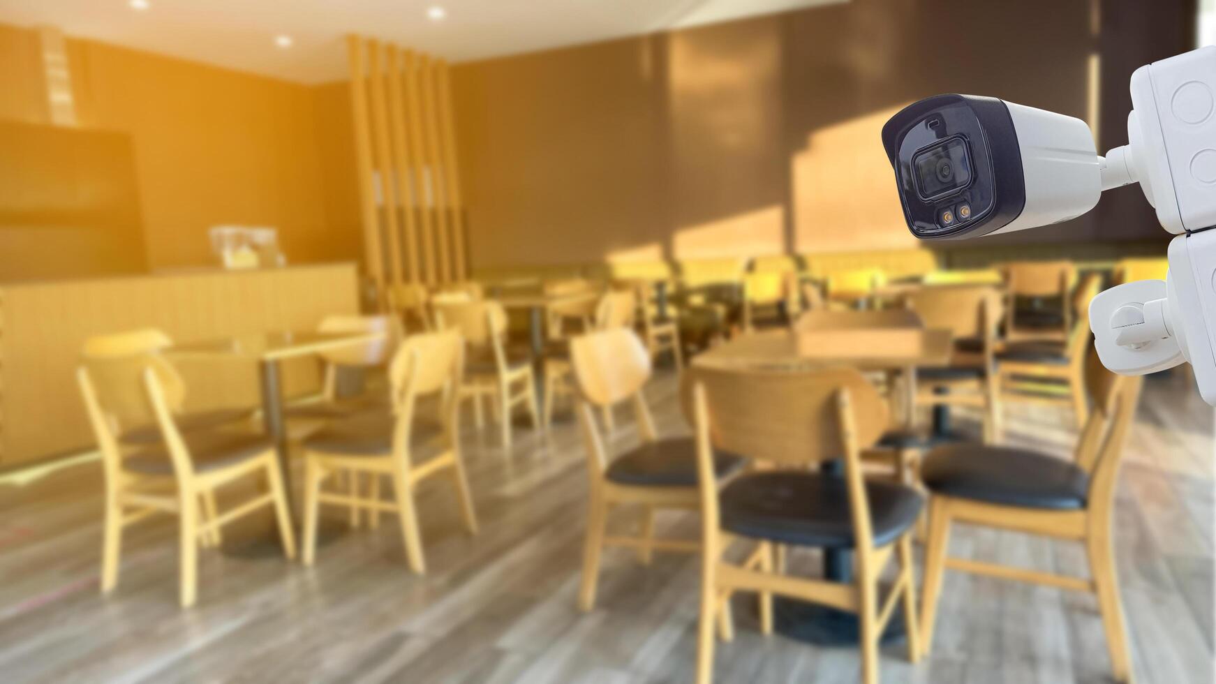 Security CCTV camera installed in coffee shop photo