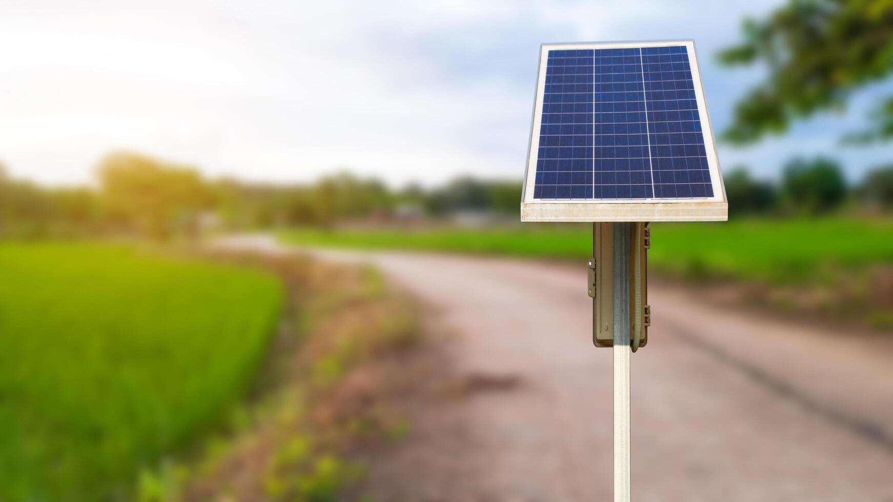 Solar panels installed along the roadside, powering street lights for nighttime illumination photo