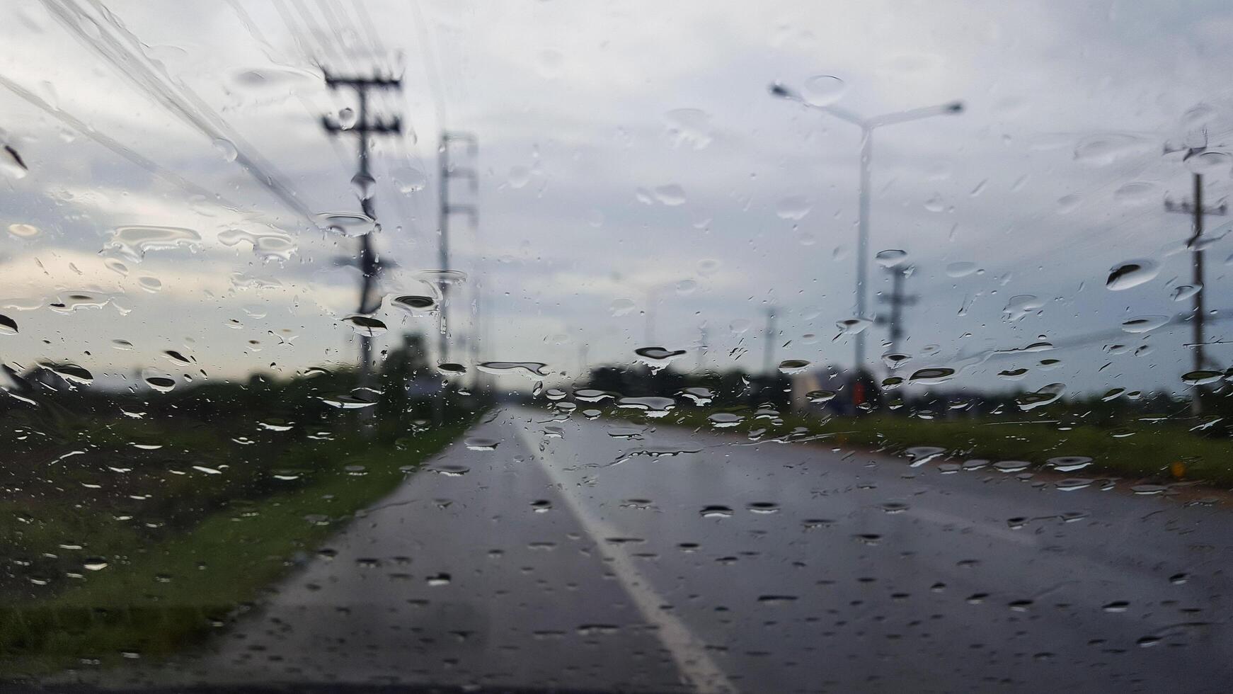 Rainwater drops cover on glass photo