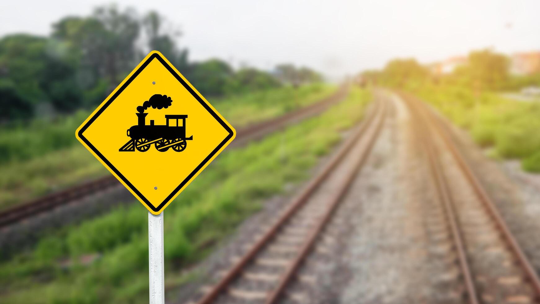 Train warning sign to warn people when crossing the train tracks photo