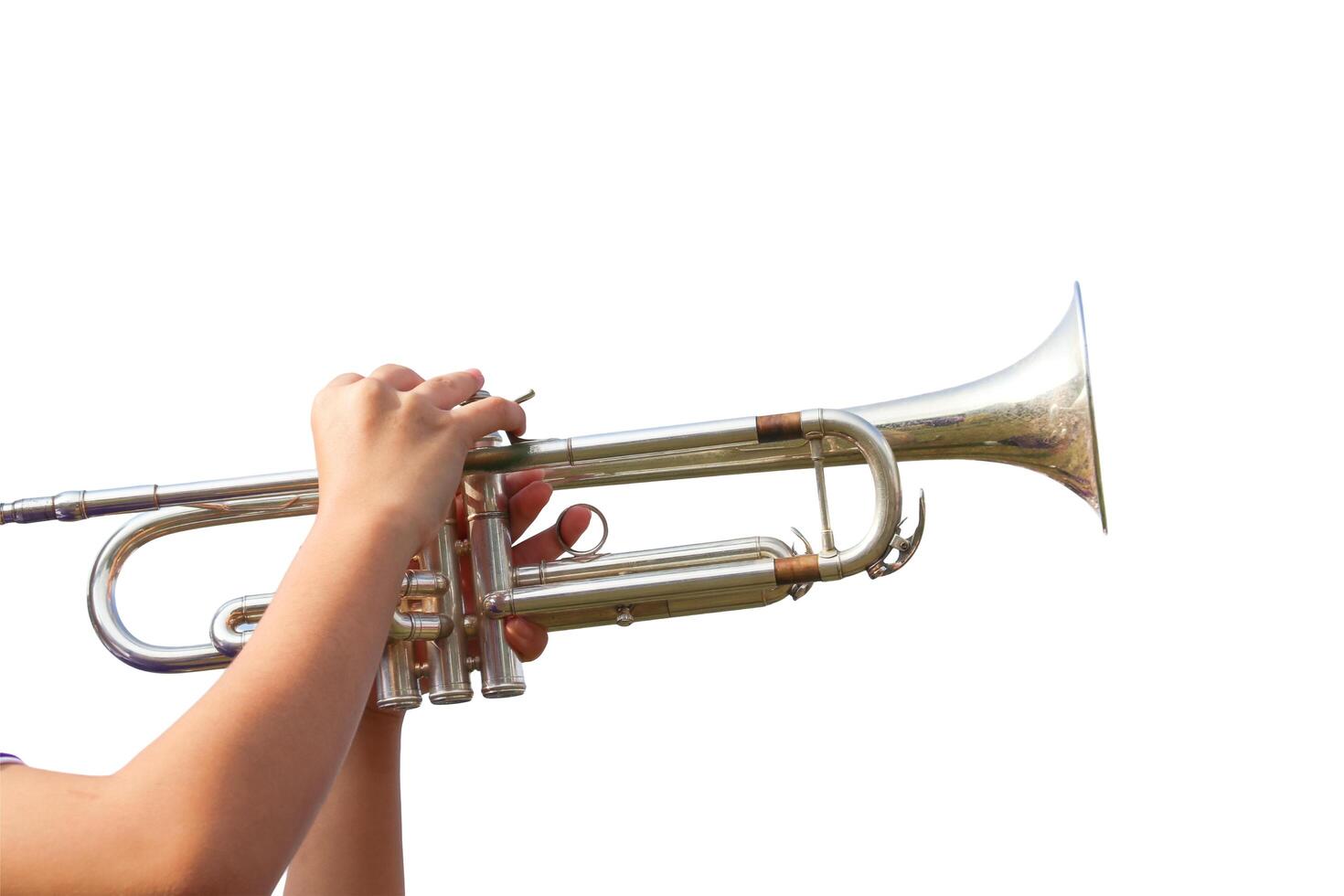 A cut-out of hands playing a trumpet on a white background with clipping paths. photo