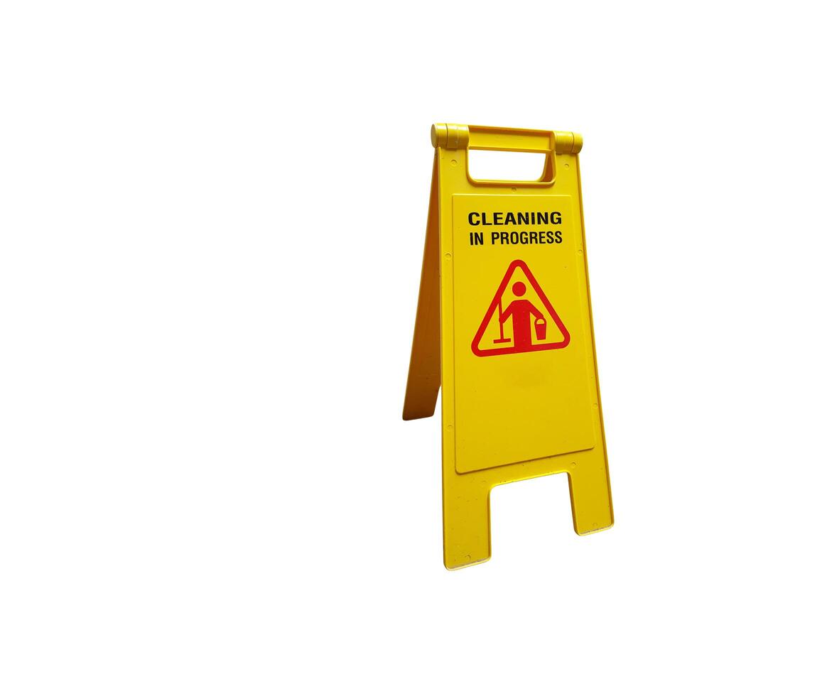 A cut-out of a yellow caution wet floor sign on a white background with clipping paths. photo