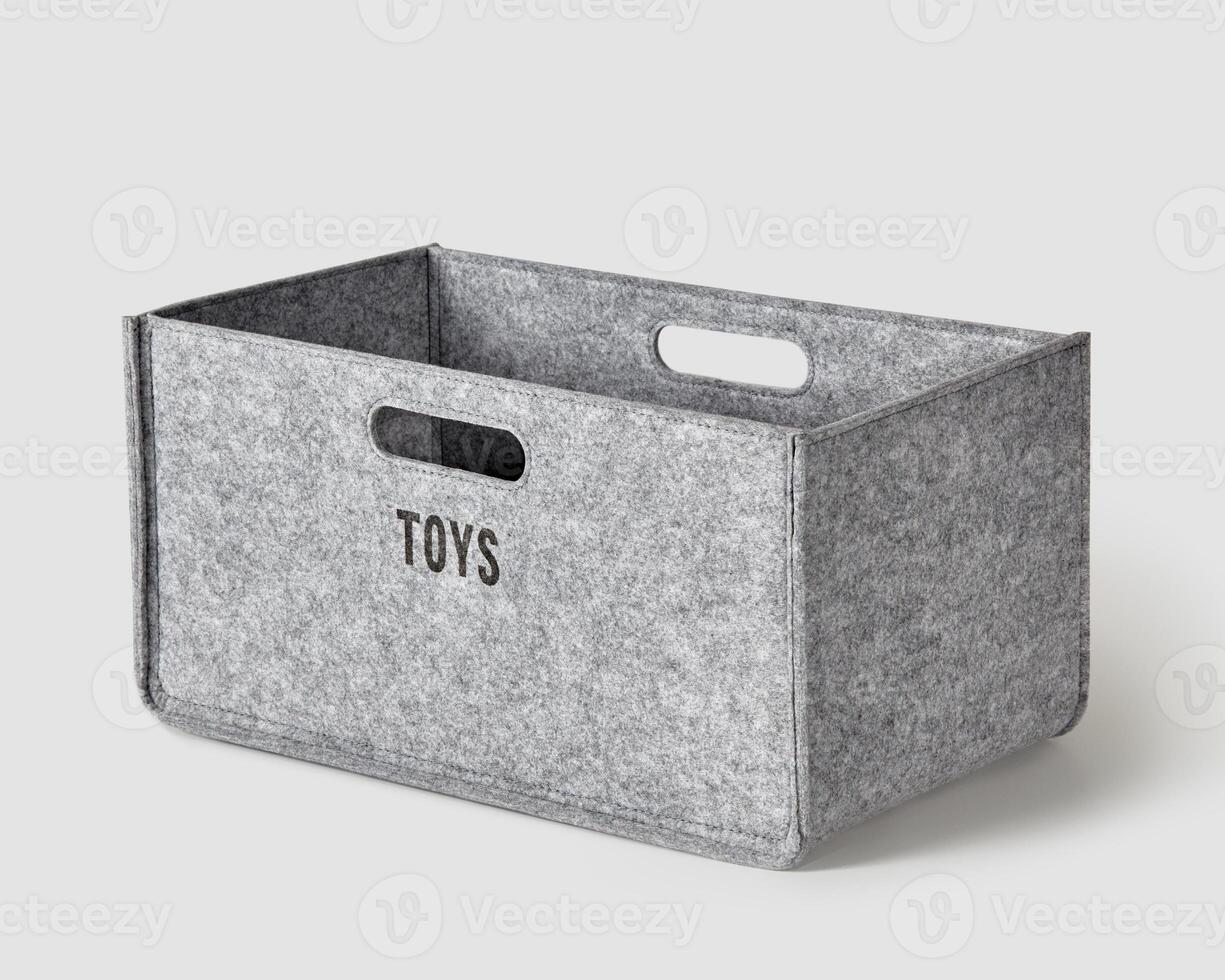 Handcrafted gray felt box with handles for storing toys photo