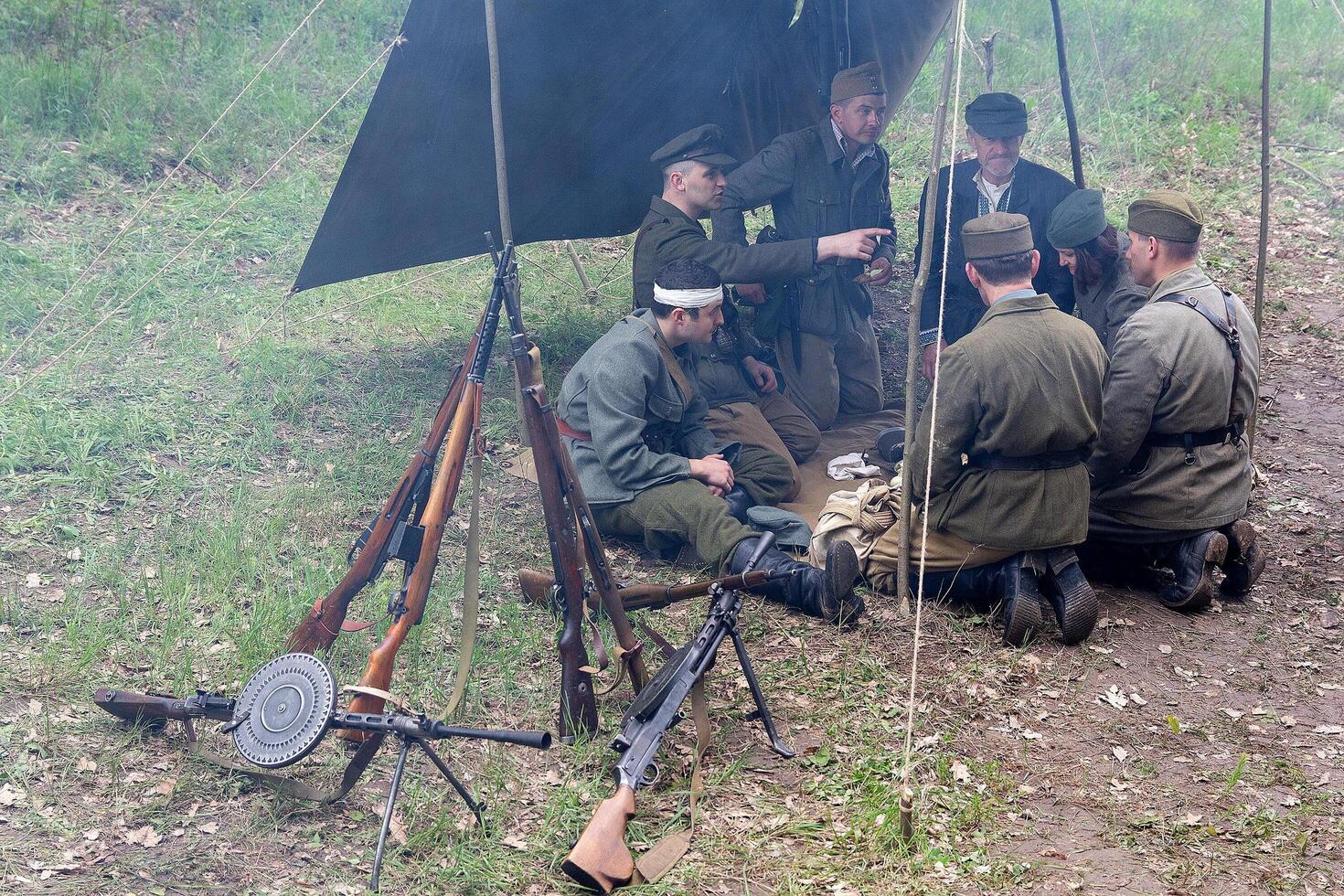 People in the form of fighters of the Ukrainian insurgent army at a historical festival on the anniversary of the end of the Second World War photo