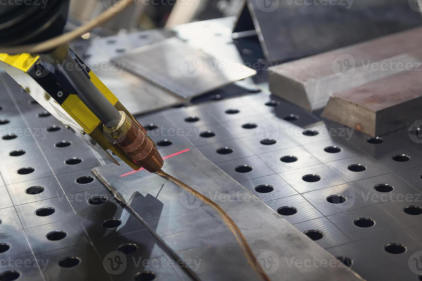 Automatic welding robot in a modern factory in operation photo