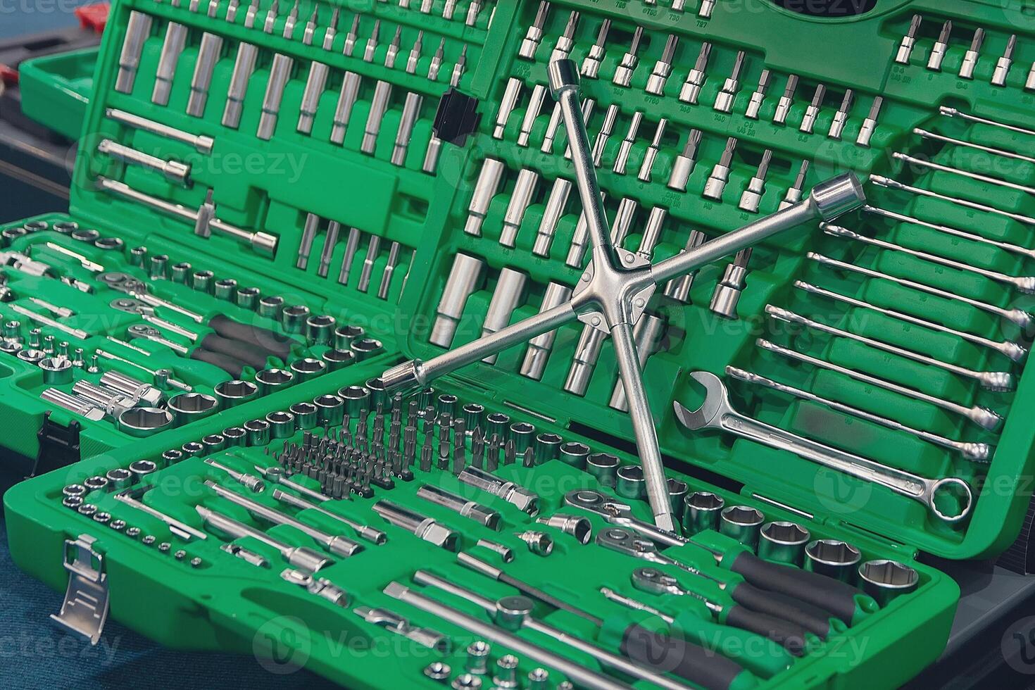 Tools and toolbox on the shop showcase. Many wrench and nuts in toolkit sets photo