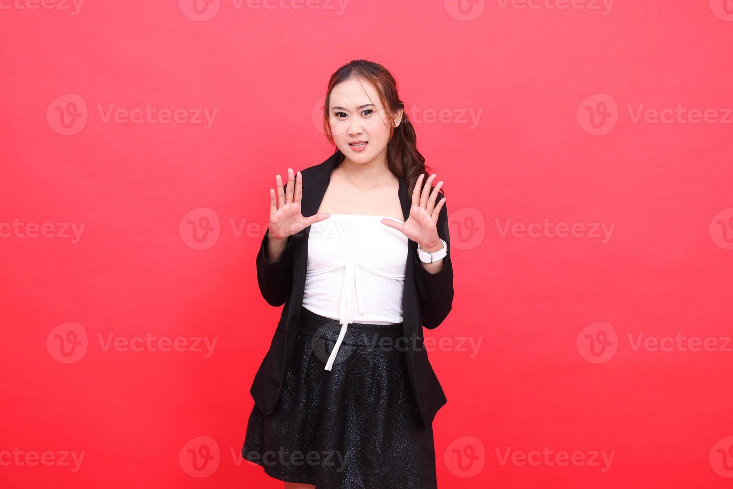 gesture of young asian office woman standing annoyed wearing black formal suit hands open to front, for corporate content, fashion, advertising, broadcast photo