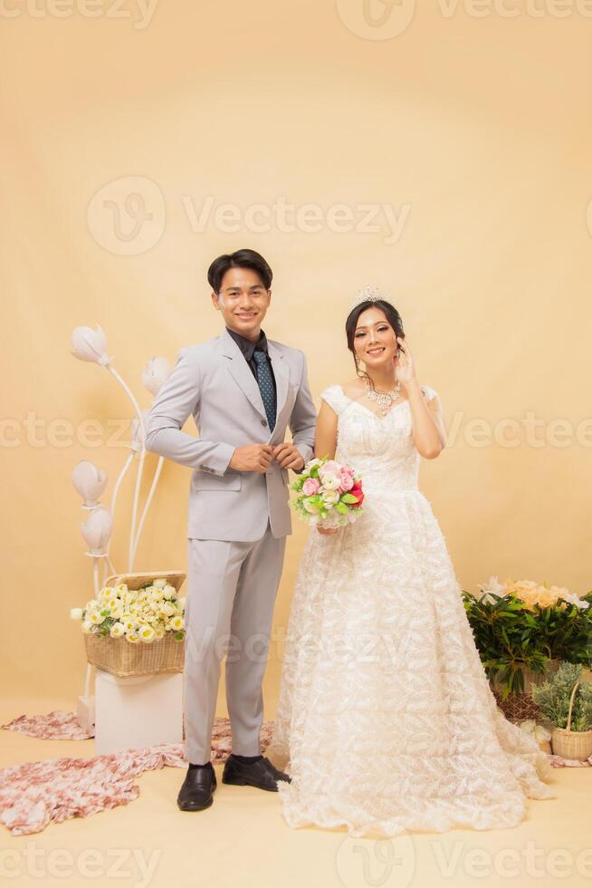 cheerful expression male and female couple in formal poses standing relaxed smiling looking at each other intimately indoor photo shot. couple wedding national bride studio