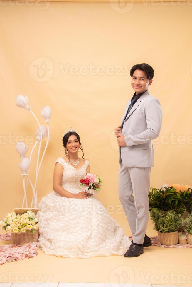 cheerful expression male and female couple in formal poses standing relaxed smiling smiling each other laughing looking forward intimately woman sitting. couple wedding national bride studio photo