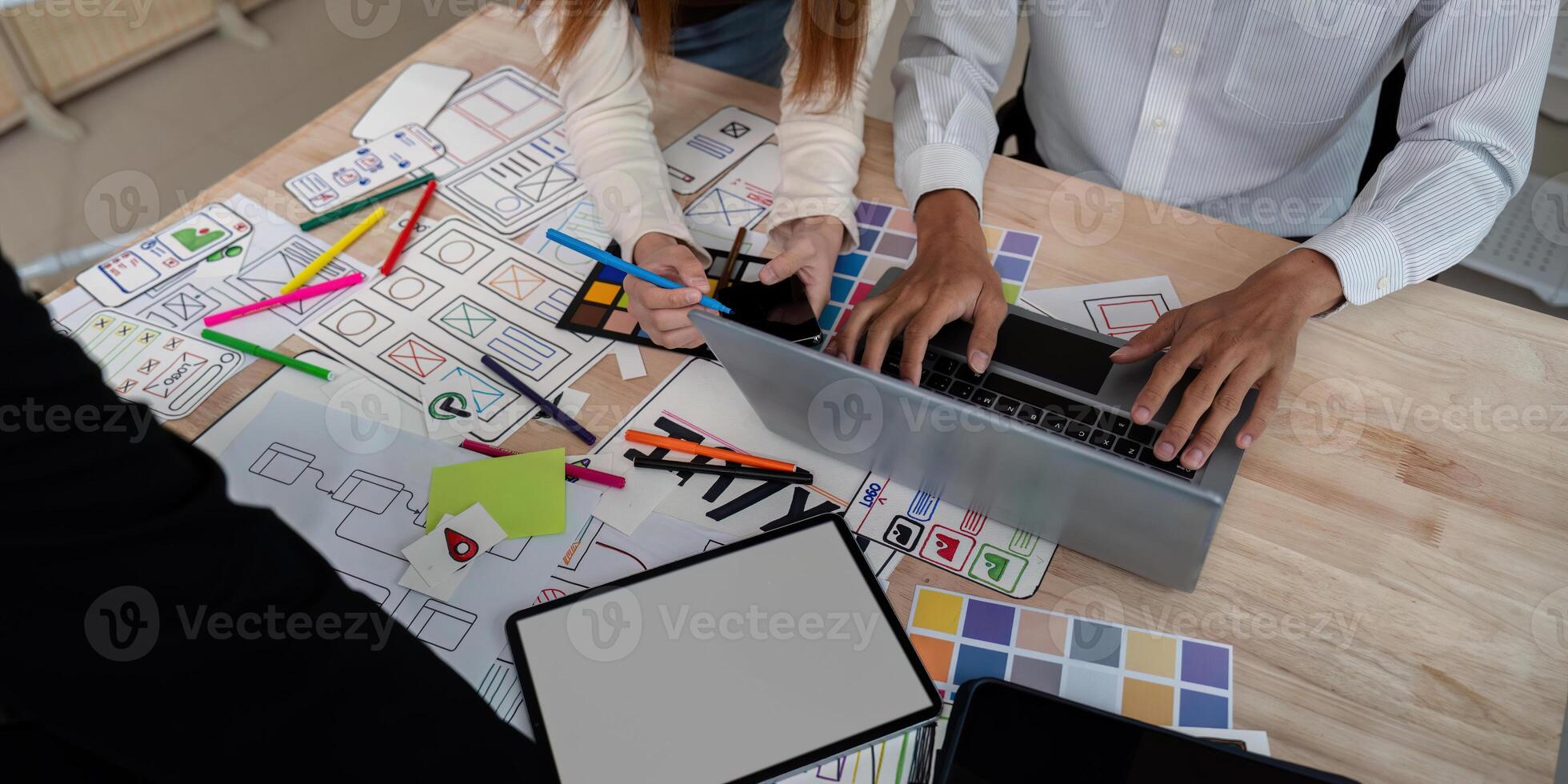 Brainstorm team of creative web graphic designer planning, Group of mobile phone app developer team meeting for share ideas about screen prototype layout for smartphone. startup planning ui and ux photo