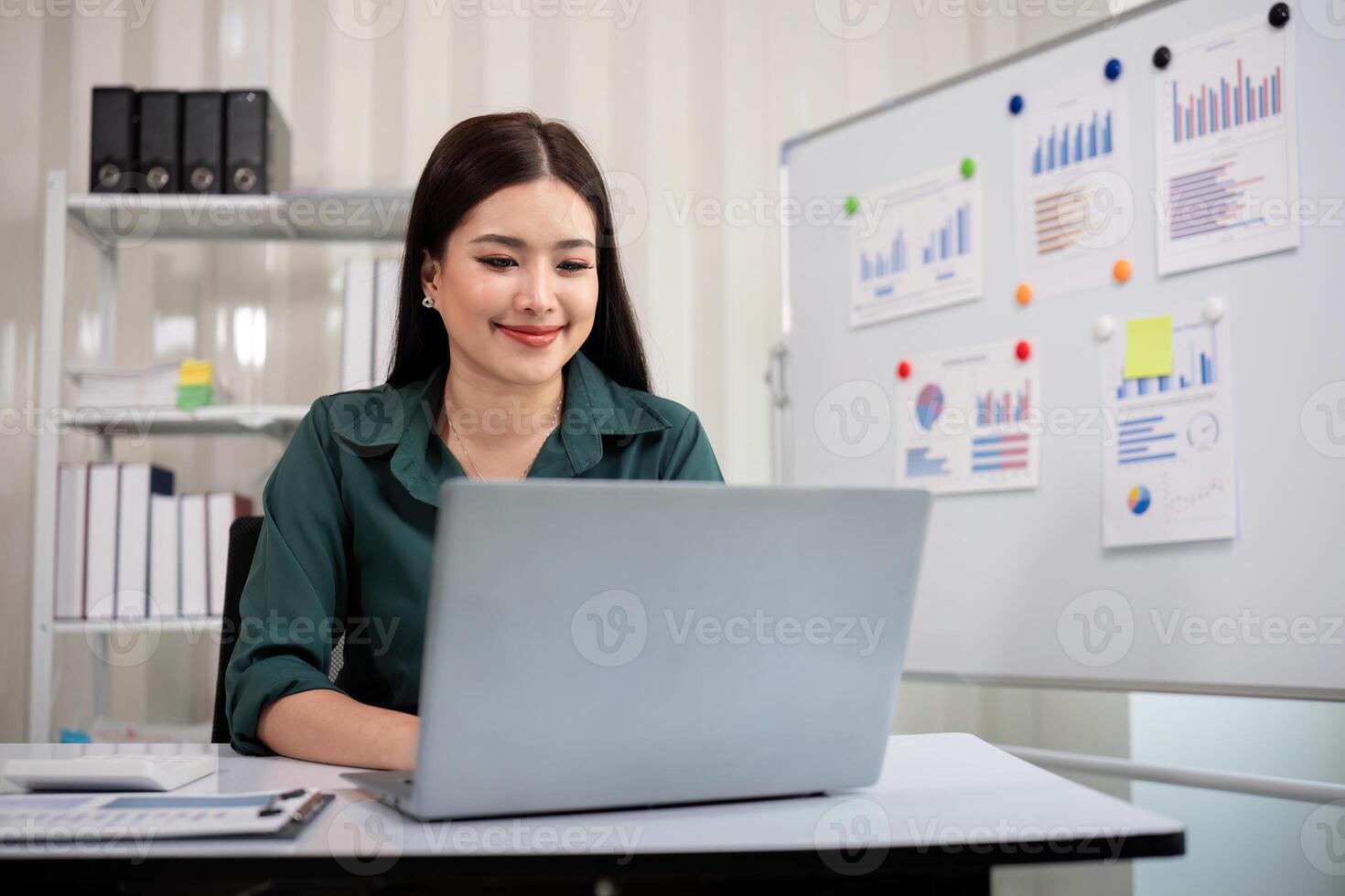 Business accounting woman counting on calculator working on financial document in hands closeup. Bookkeeping concept photo