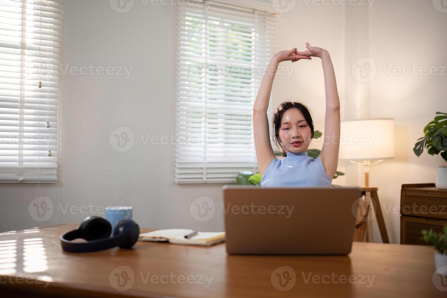Asian young student doing stretch oneself from study online class. Online distance learning education concept photo