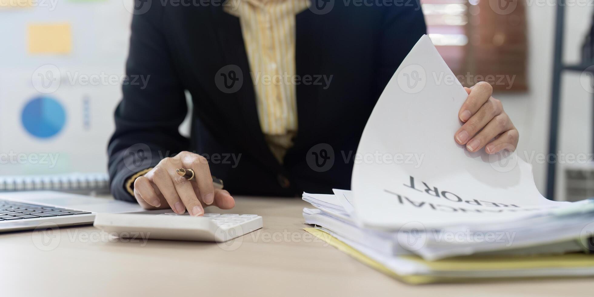 Accountant, bookkeeper using calculator to calculate financial report . account and allocating company budget. photo