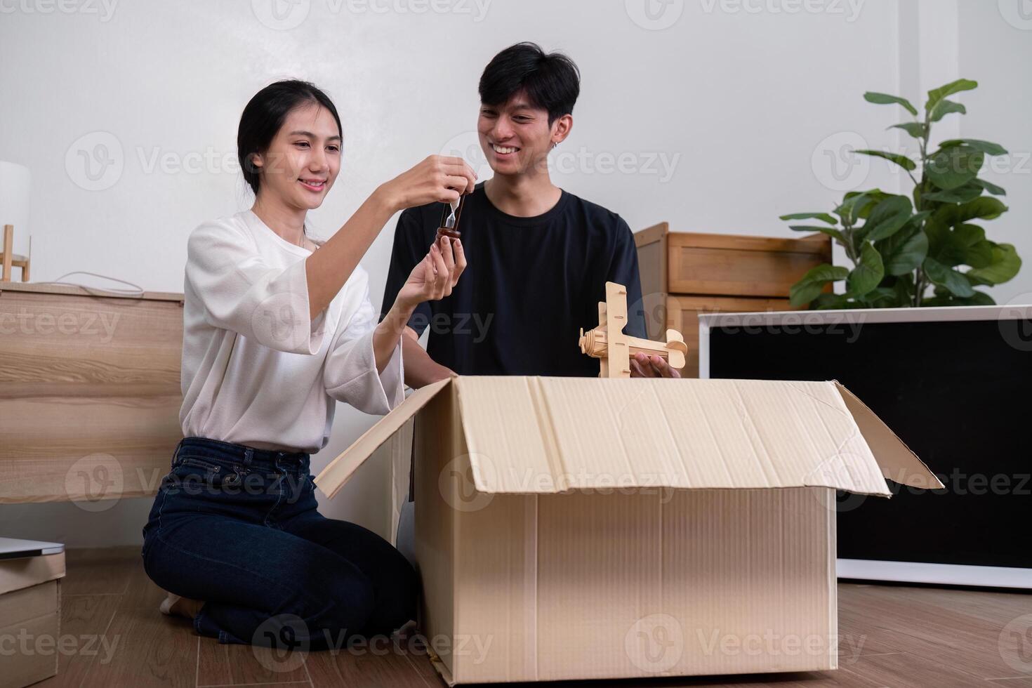 Happy Couple Unpacking Boxes in Their New Home, Starting a New Chapter Together in a Modern House photo