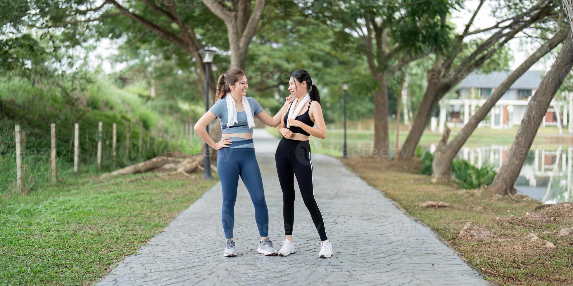 Two Friends Enjoying a Morning Run Together in a Scenic Park Setting, Promoting Fitness and Healthy Lifestyle photo