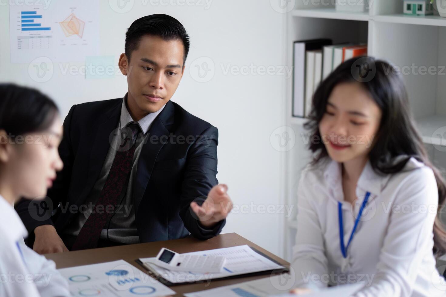 Business Team Discussing Analysis and Planning in a Modern Office Setting During a Meeting photo