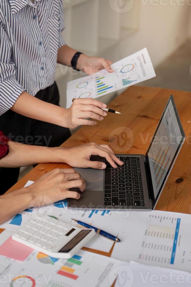 Business Team Collaboration on Data Analysis with Charts and Graph in Modern Office Setting photo