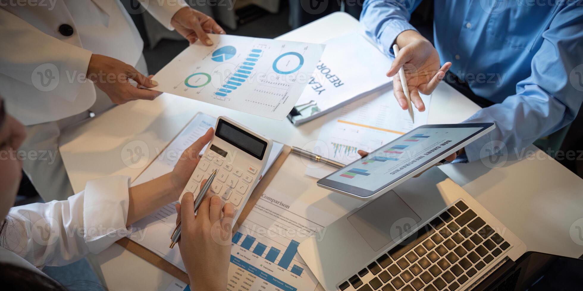 Business Team Collaboration on Financial Analysis with Charts, Graphs, and Report in a Modern Office Setting photo