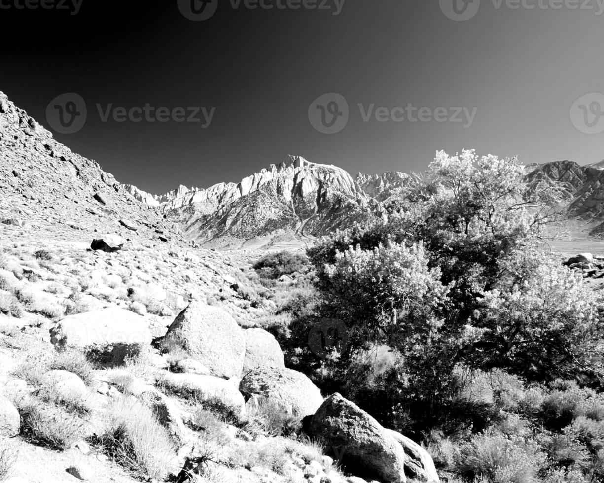 Mountains black and white photo background. High mount, rocks and hills landscape