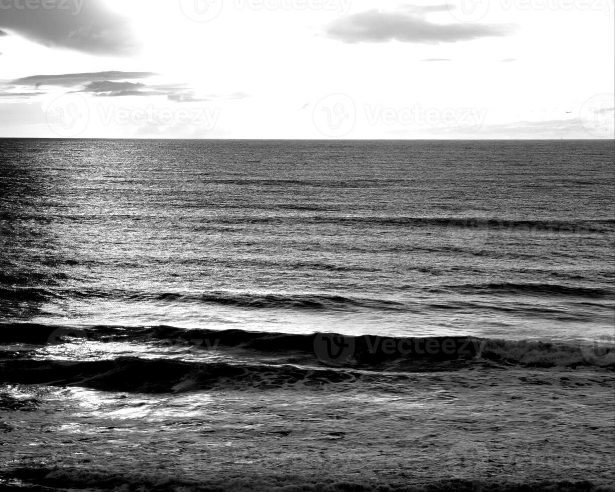 Sea waves, ocean shore, beach black and white photo background