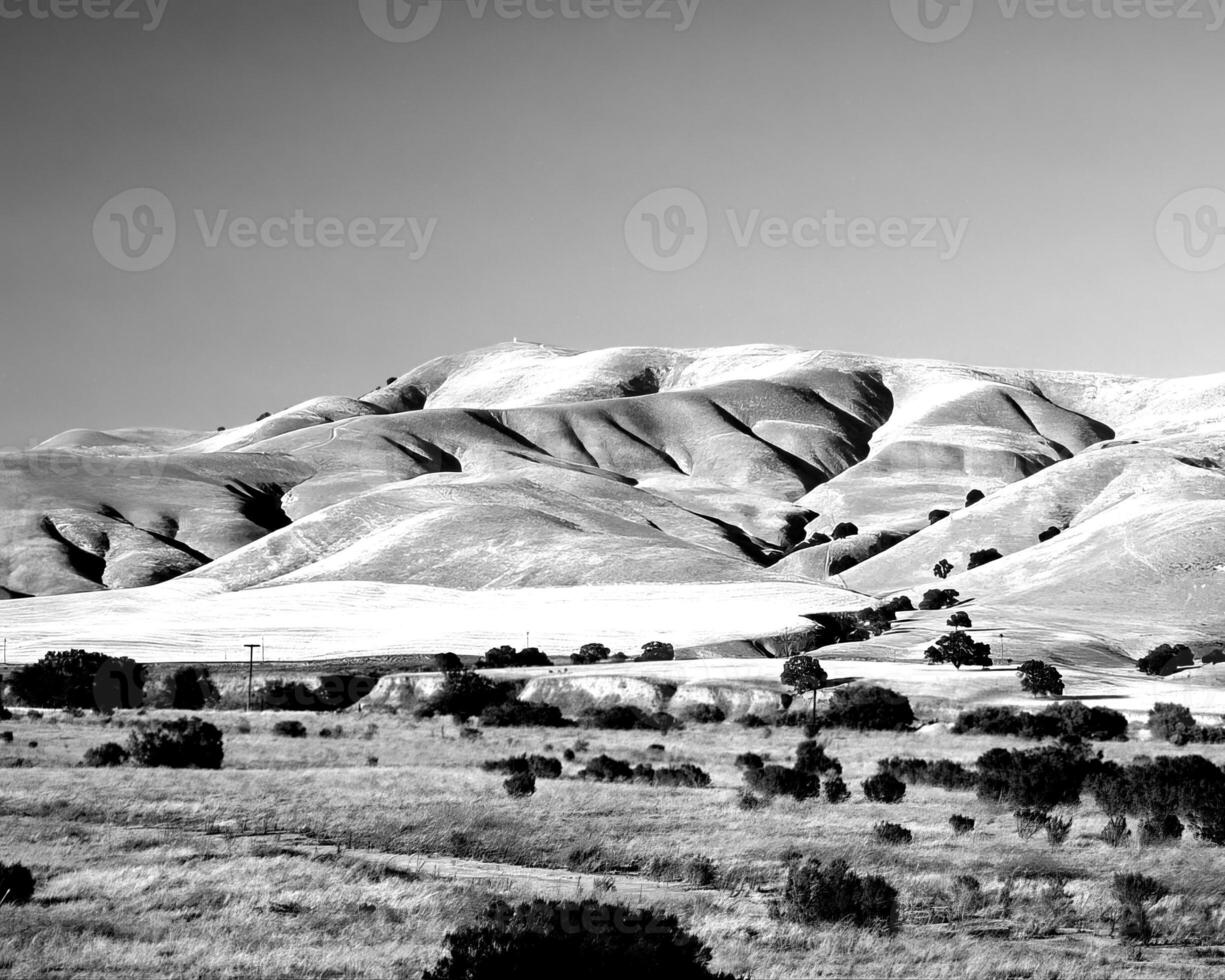 Mountains black and white photo background. High mount, rocks and hills landscape