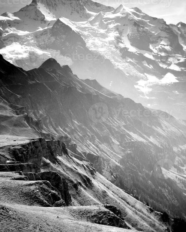 Mountains black and white photo background. High mount, rocks and hills landscape