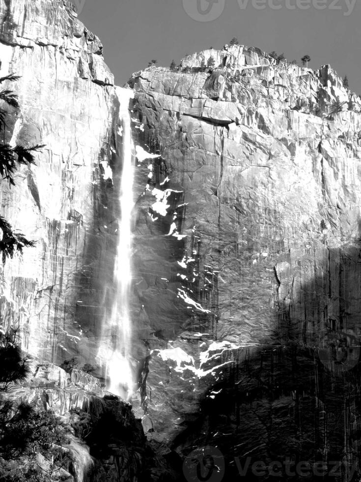 Waterfall and the mountain river background. Waterscape natural environment black and white photo background
