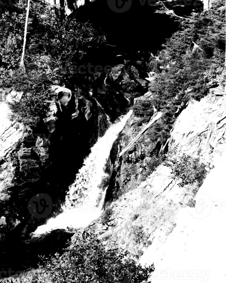 Waterfall and the mountain river background. Waterscape natural environment black and white photo background