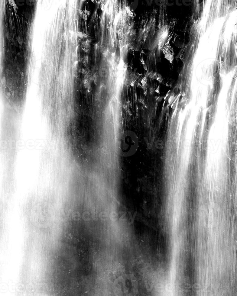 Waterfall and the mountain river background. Waterscape natural environment black and white photo background