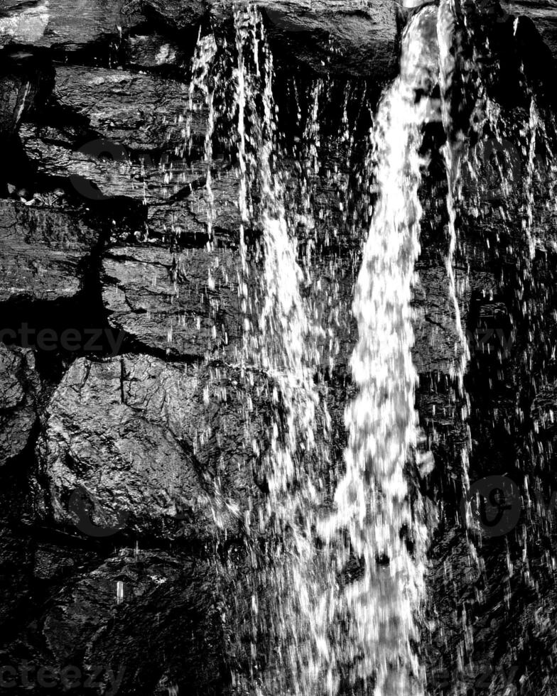 Waterfall and the mountain river background. Waterscape natural environment black and white photo background