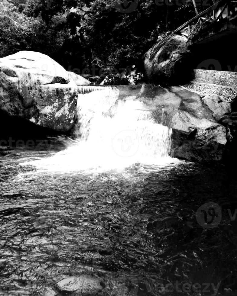 Waterfall and the mountain river background. Waterscape natural environment black and white photo background