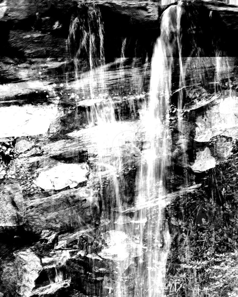 Waterfall and the mountain river background. Waterscape natural environment black and white photo background