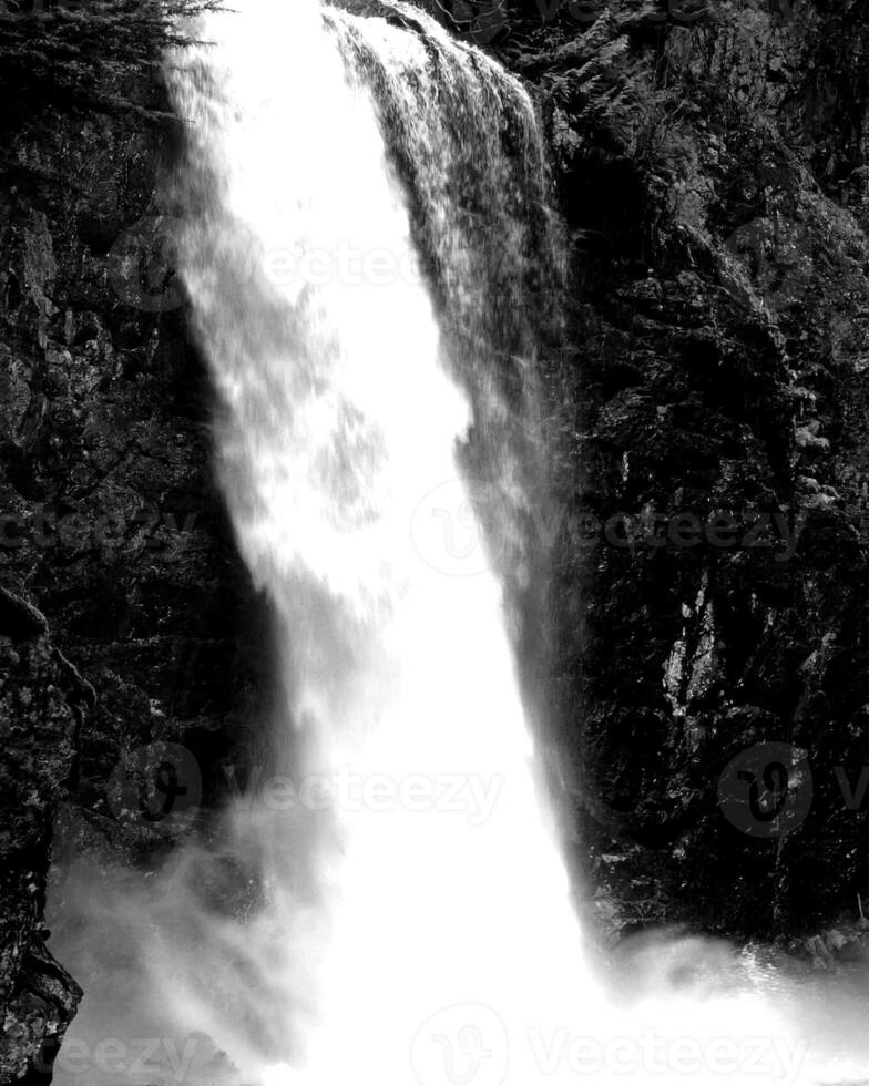 Waterfall and the mountain river background. Waterscape natural environment black and white photo background