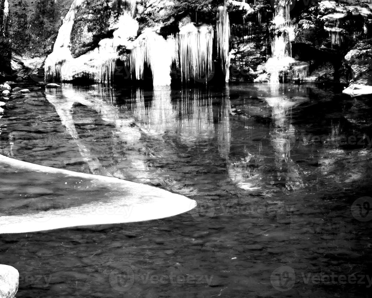 Waterfall and the mountain river background. Waterscape natural environment black and white photo background